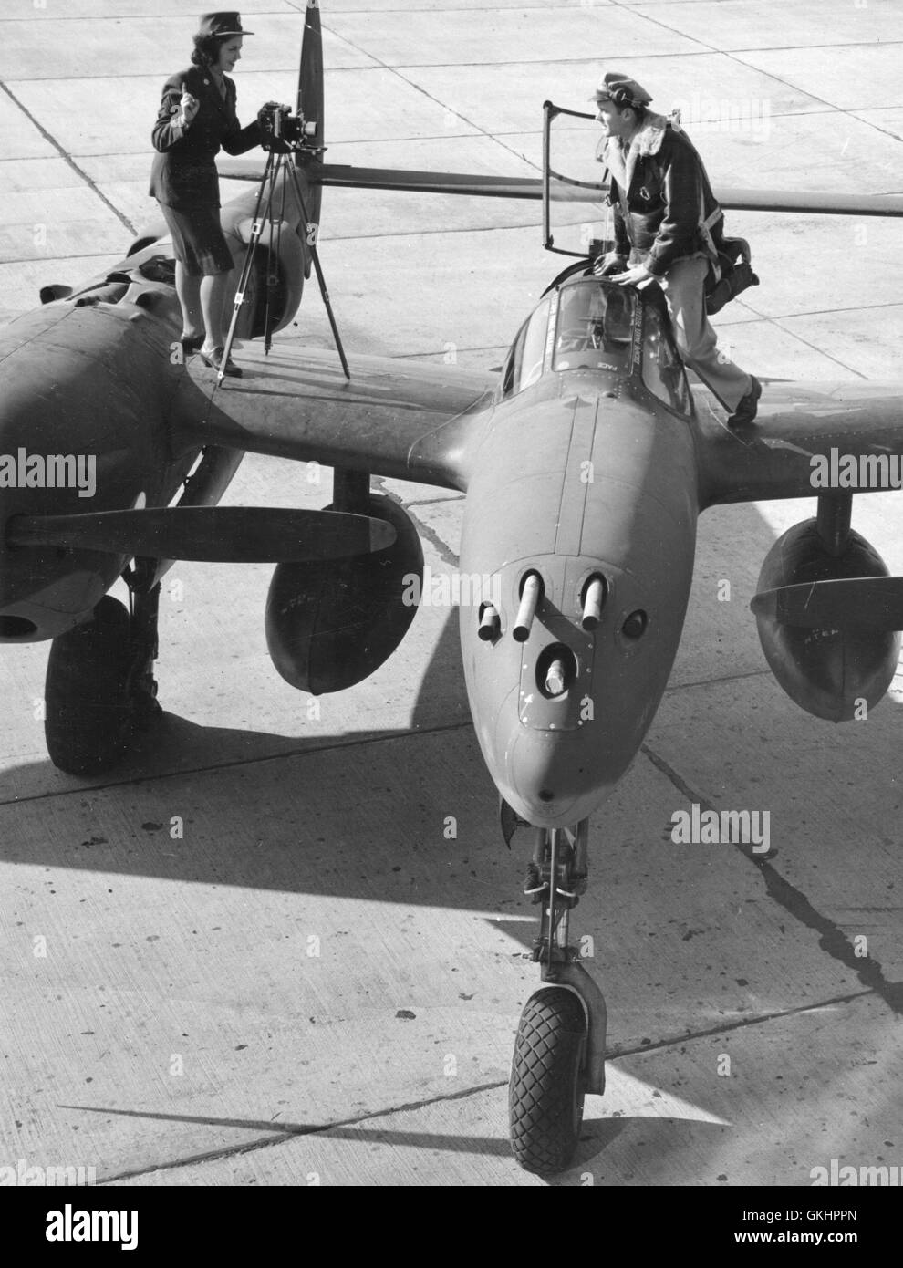 Photo Technician Sgt Virginia Hull photographs P-38 pilot Major Robert W. Springer. Sgt Hull is deft at developing and printing, as well as taking photos. Stock Photo