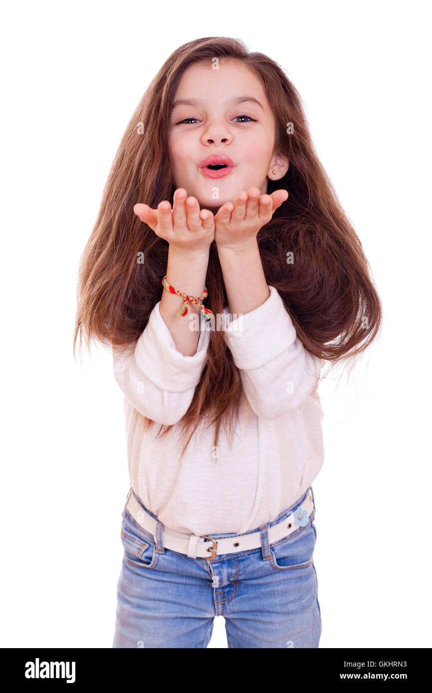 Happy little Girl Blowing a Kiss, isolated on white background Stock