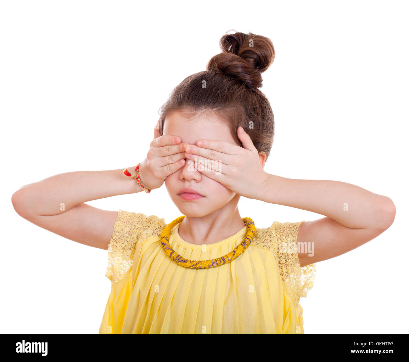 See No Evil, Hear No Evil, do not say anything, Portrait of beautiful little girl, studio on white background Stock Photo