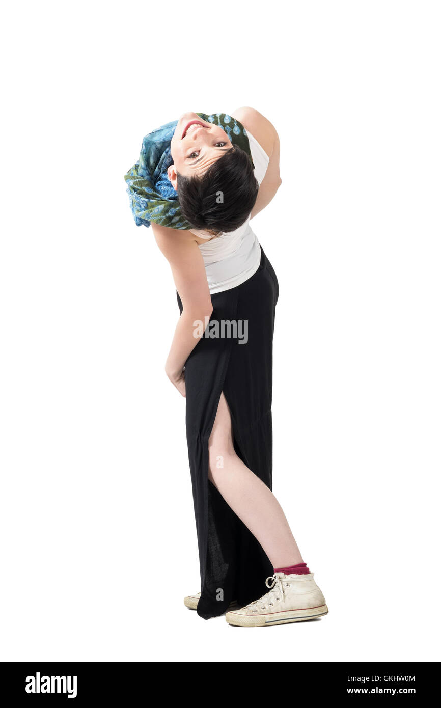 Awkward pose of young playful short hair woman bending backwards and ...