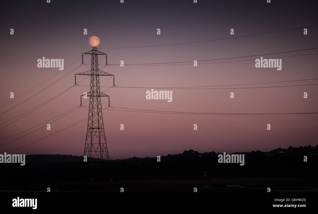 Electricity Stanchion and moon Stock Photo