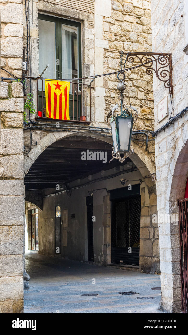 Flag of independence movement of Catalonia, called Estelada (unofficial) in a street of downtown of Girona, Costa Brava, Spain. Stock Photo