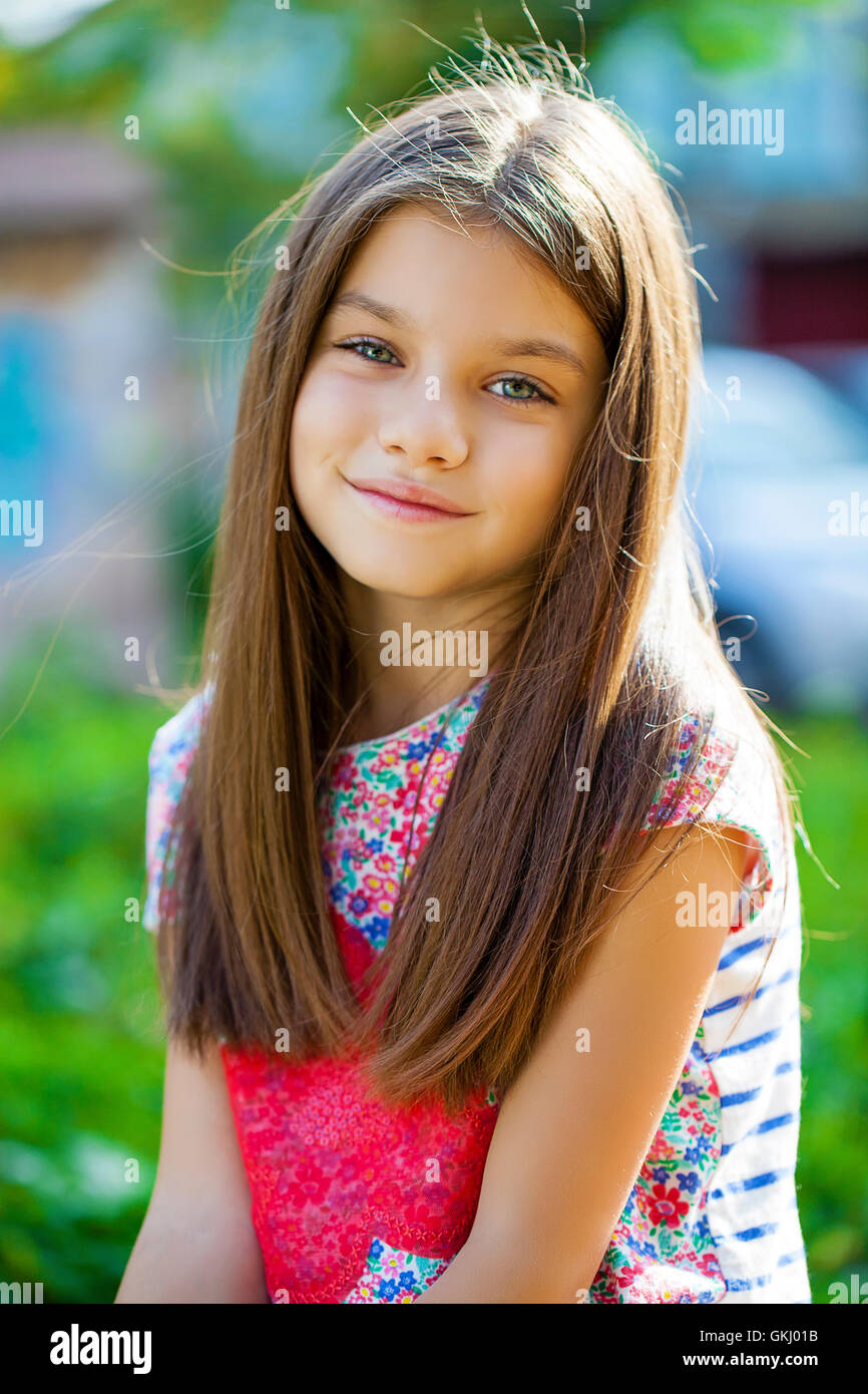 Beautiful Happy little girl outdoors Stock Photo