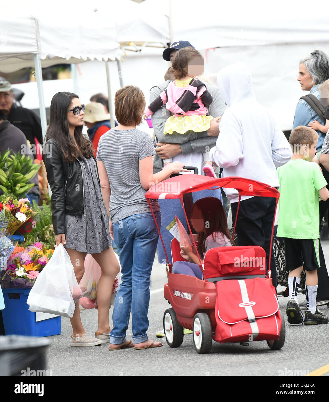 Ashton Kutcher and Mila Kunis take their daughter Wyatt to the Farmers
