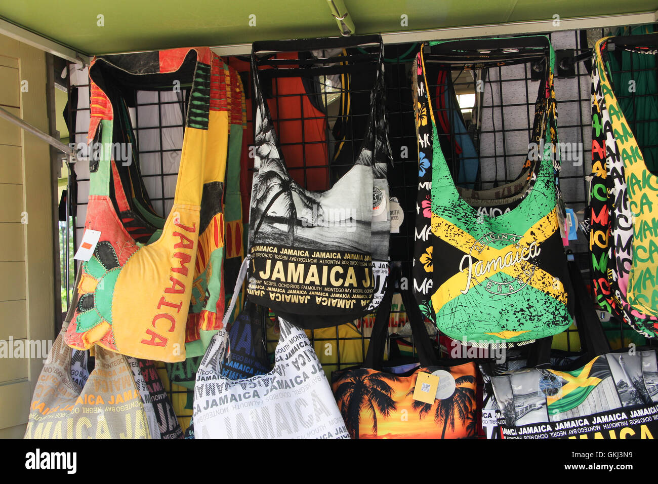 Jamaica port vendors, flag townspeople, old Jamaica souvenirs, shops in Jamaica, Falmouth's port, tourists disembarked, purses, Stock Photo