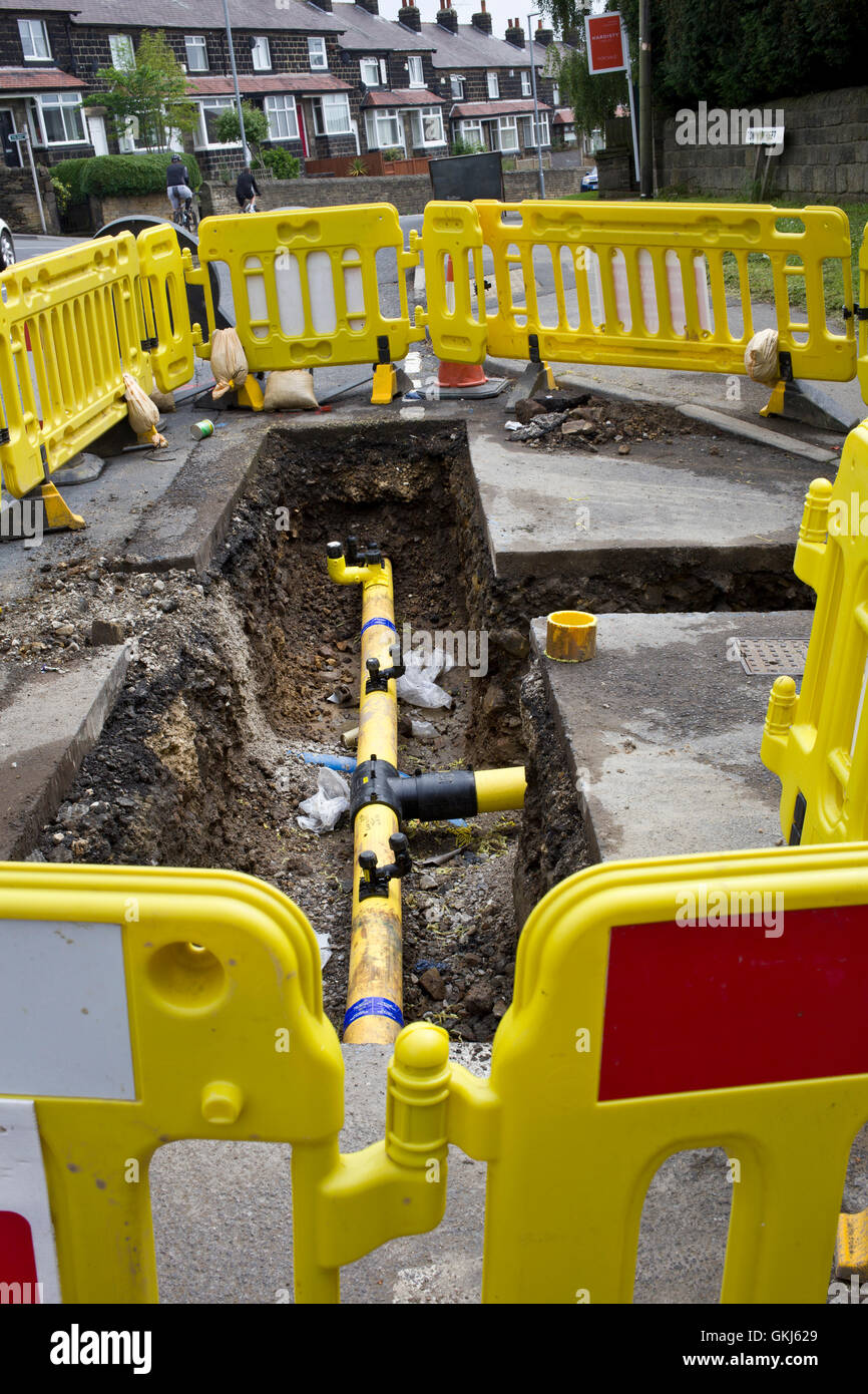 Gas pipes being replaced in road Stock Photo Alamy