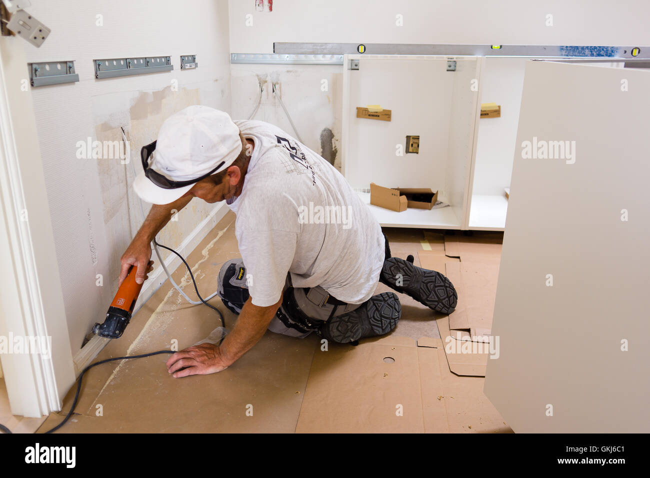 carpenter at work, mounting an IKEA kitchen Stock Photo