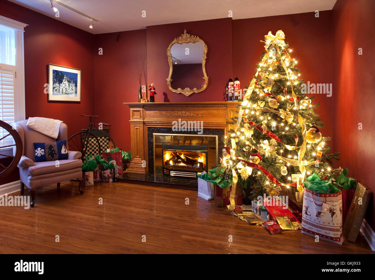 Christmas tree and mantel in living room Stock Photo