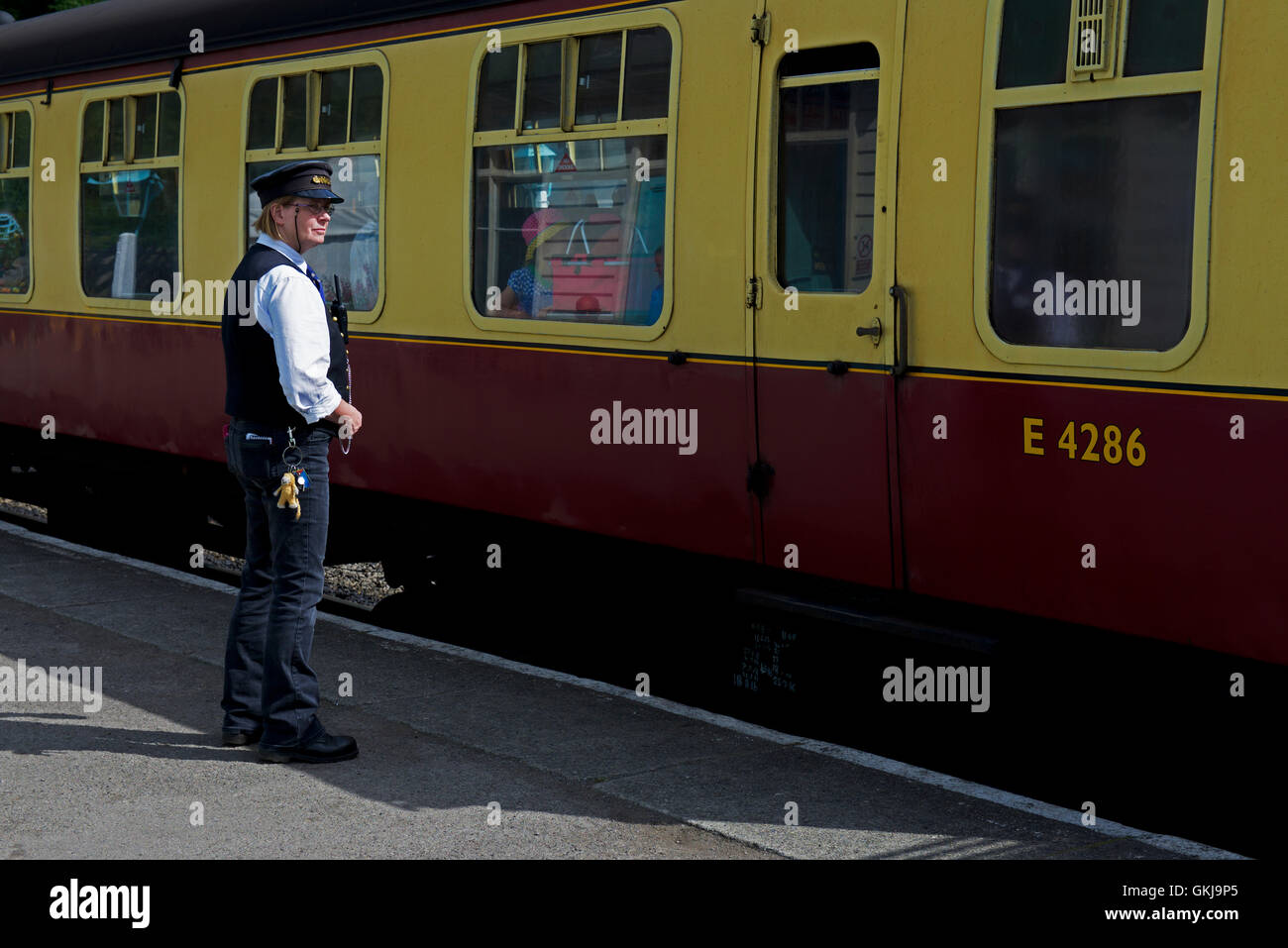 Station master (mistress?) at Grosmont railway station, the North York Moors Railway, North Yorkshire, England UK Stock Photo