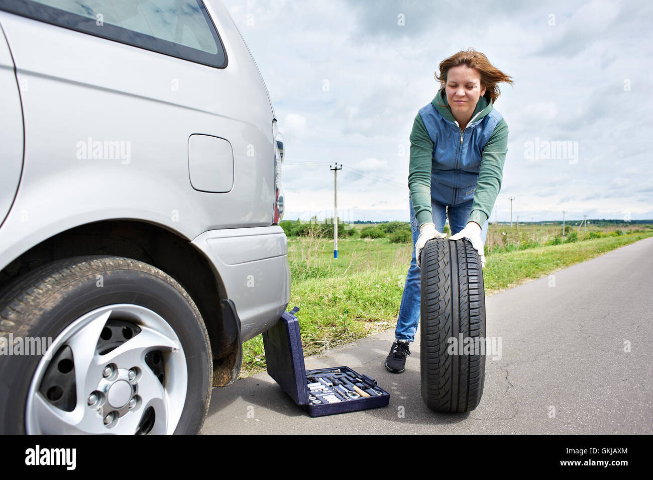 Woman Changing Wheel On Car Hi Res Stock Photography And Images Alamy