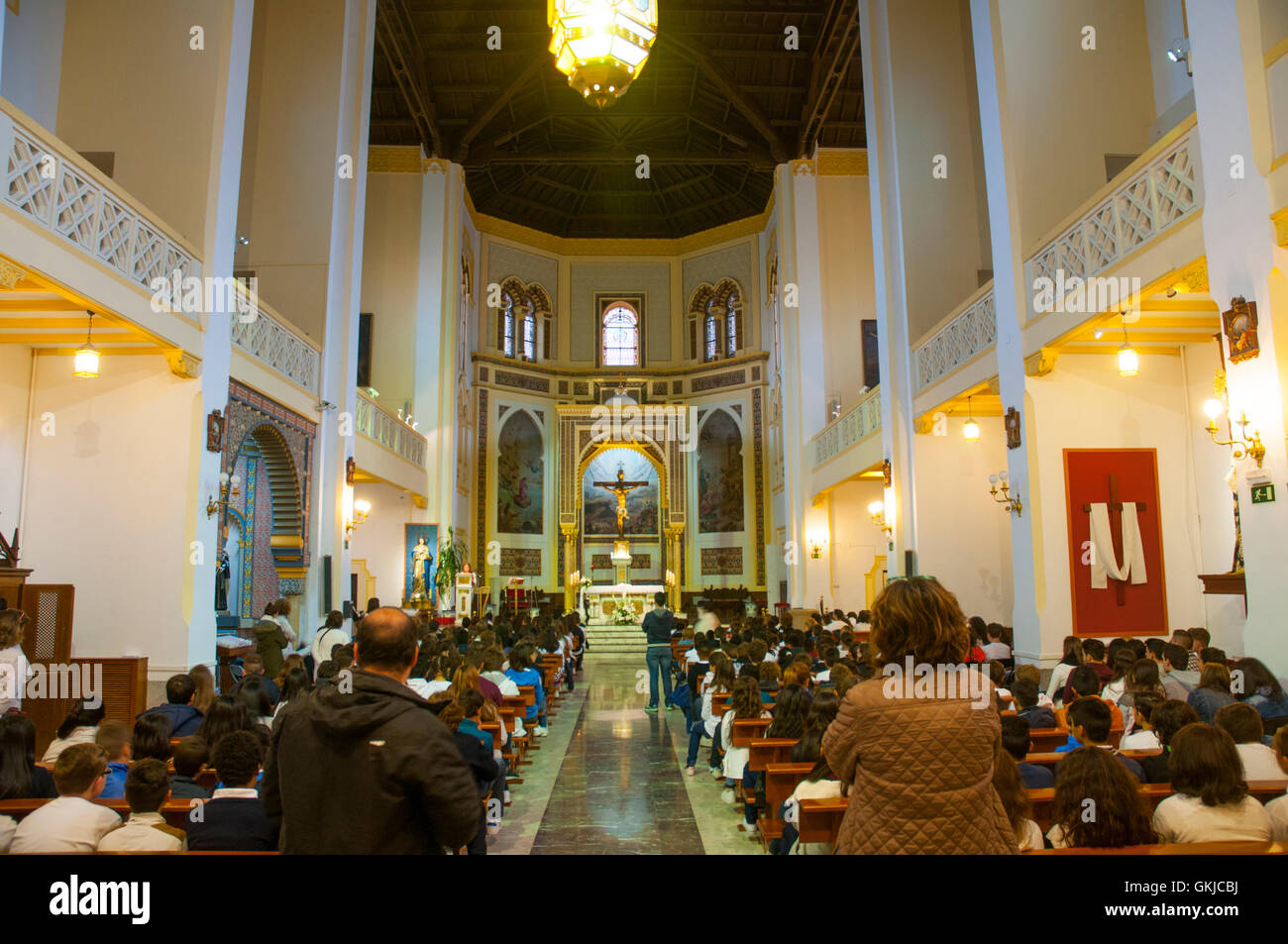 People celebrating the Mass. Santa Cristina church, Madrid, Spain. Stock Photo