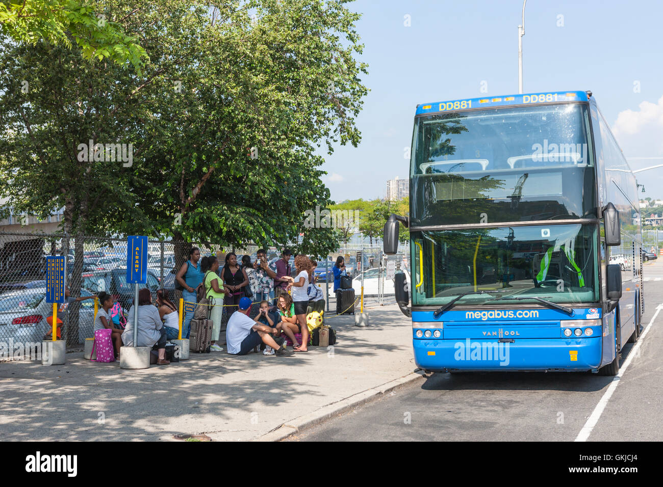 People wait to board a discount Megabus bound for Albany, New York at a