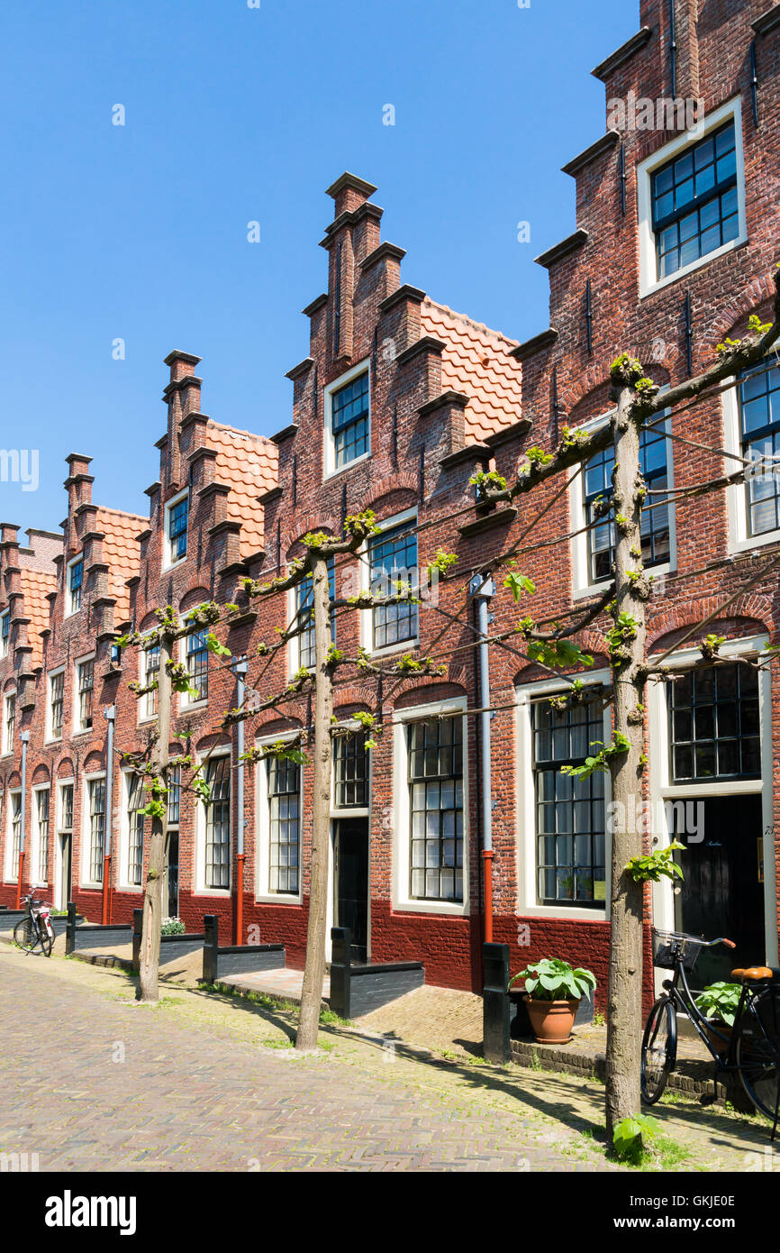 Row houses with stepped gables in Groot Heiligland street in old town of Haarlem, Holland, Netherlands Stock Photo