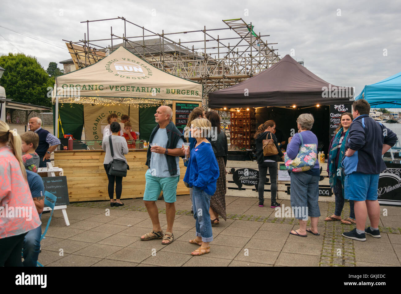 Exeter, Devon, United Kingdom - August 18, 2016: People look at their food options at Exeter Street Food Night Stock Photo