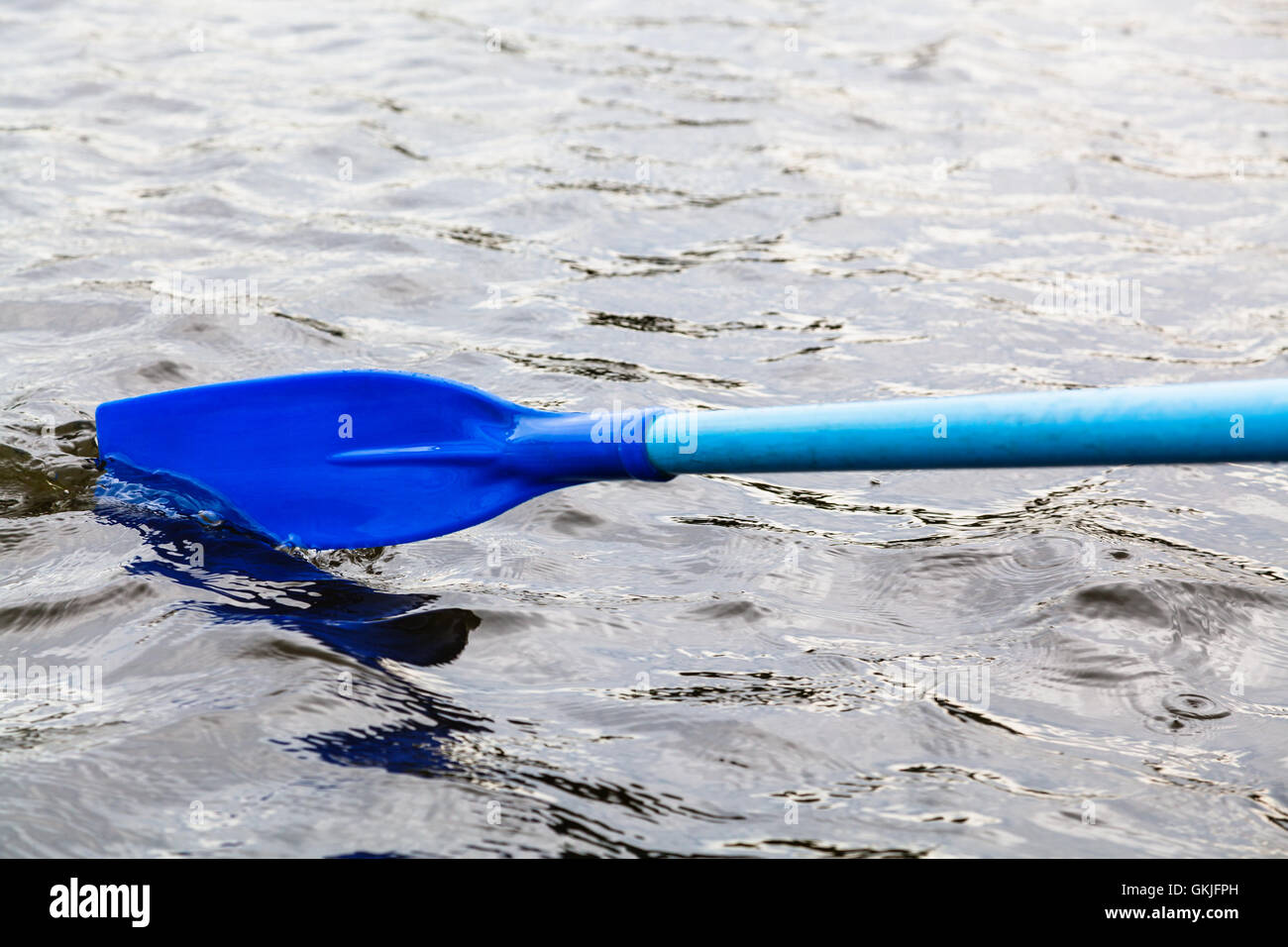 paddle blade in water during boating on the lake Stock Photo