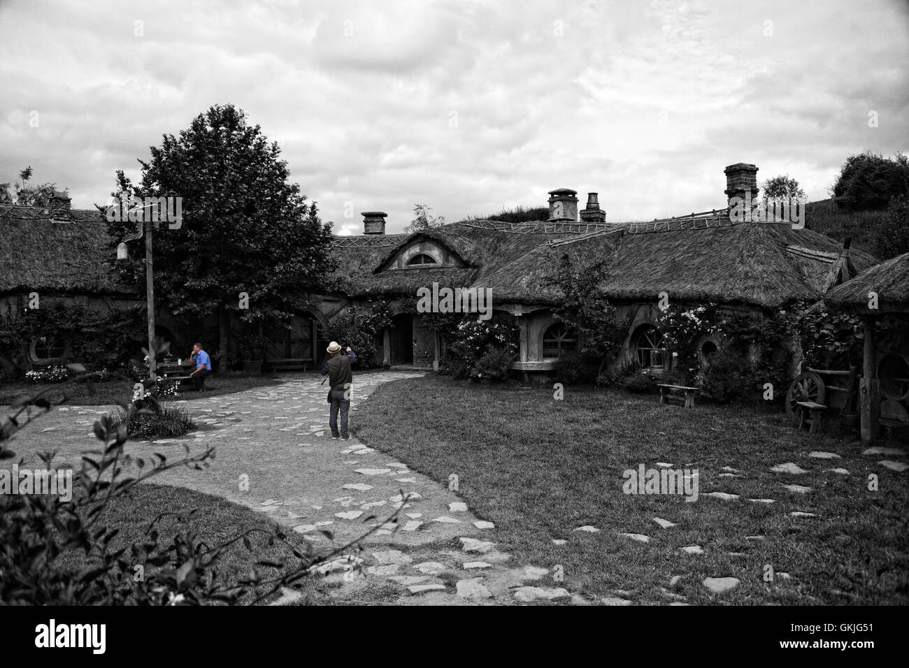 A man photographs cottages Stock Photo