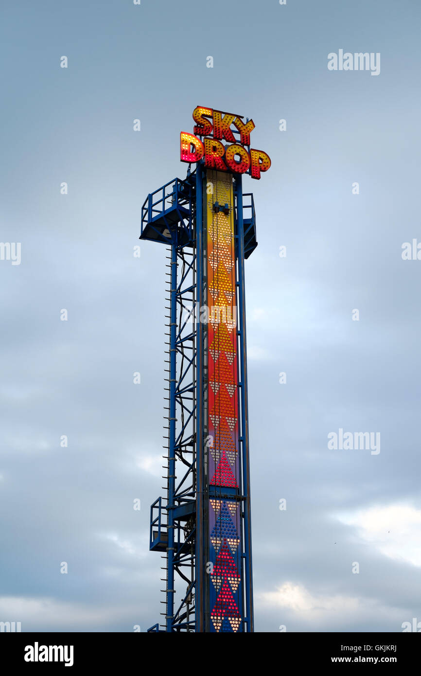 Skydrop ride at funfair in neon Stock Photo