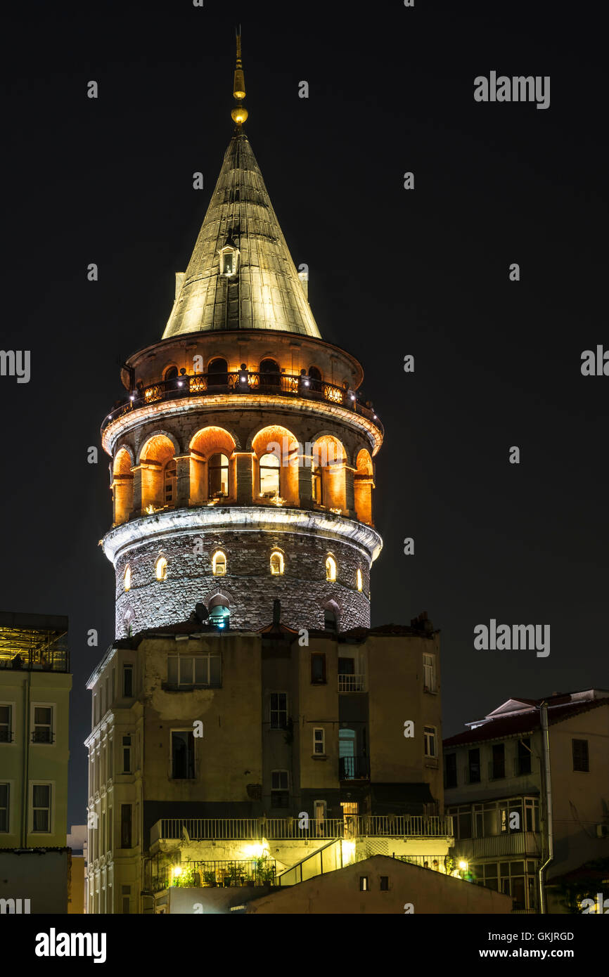 Galata Tower illuminated at night Stock Photo