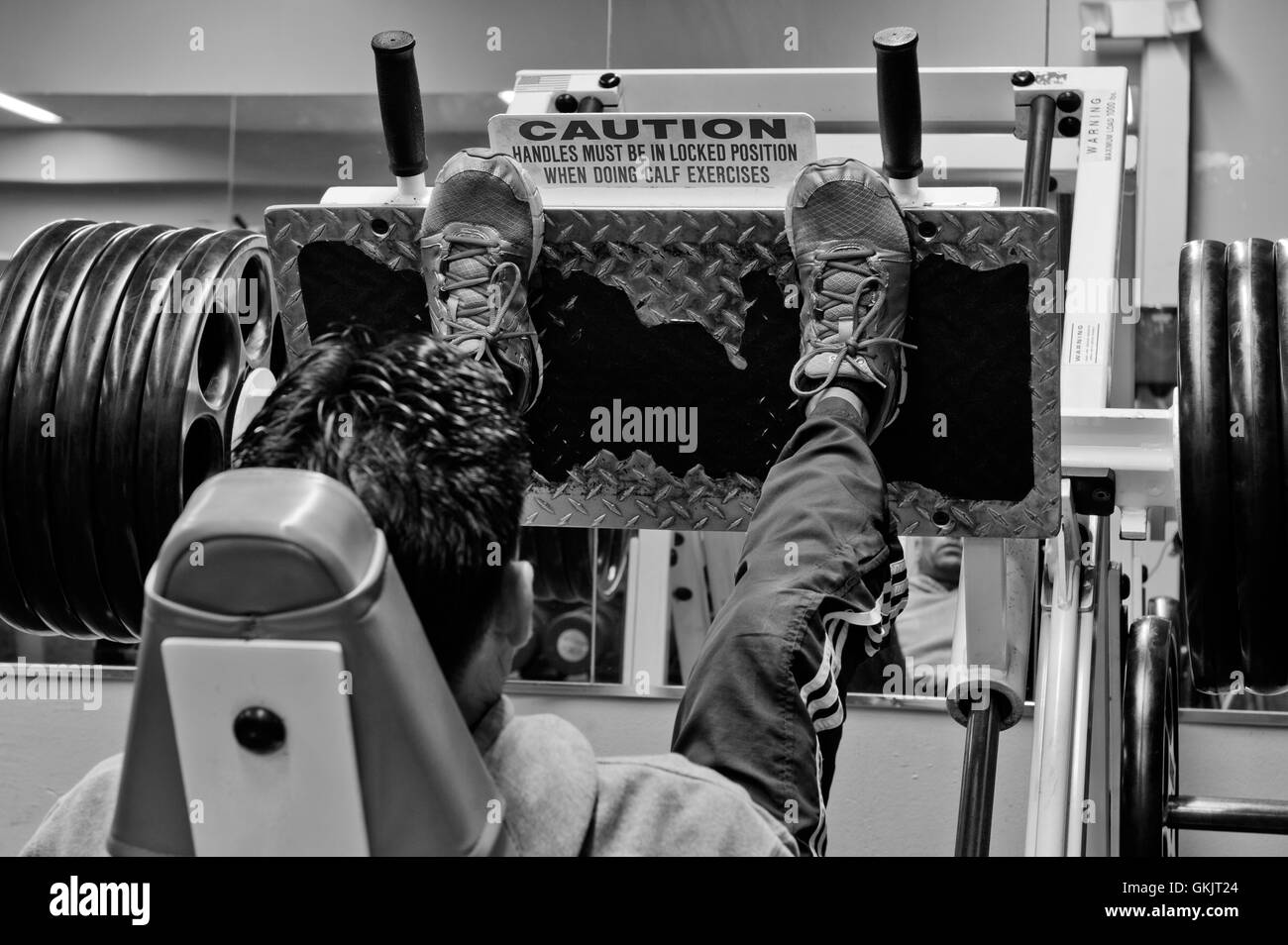 Weights loaded on the leg press Stock Photo Alamy