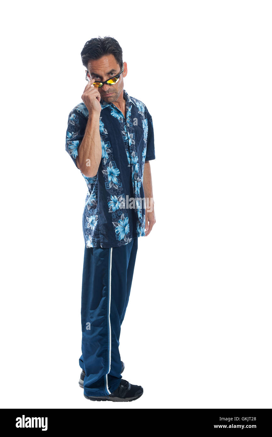 Middle age man with olive skin looking over his sunglasses. Stock Photo