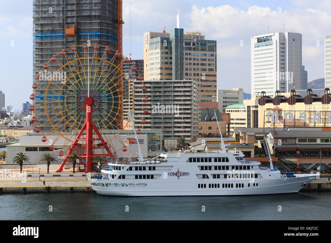The Concerto cruise ship restaurant and ferris wheel docked at Kobe, Japan. Stock Photo