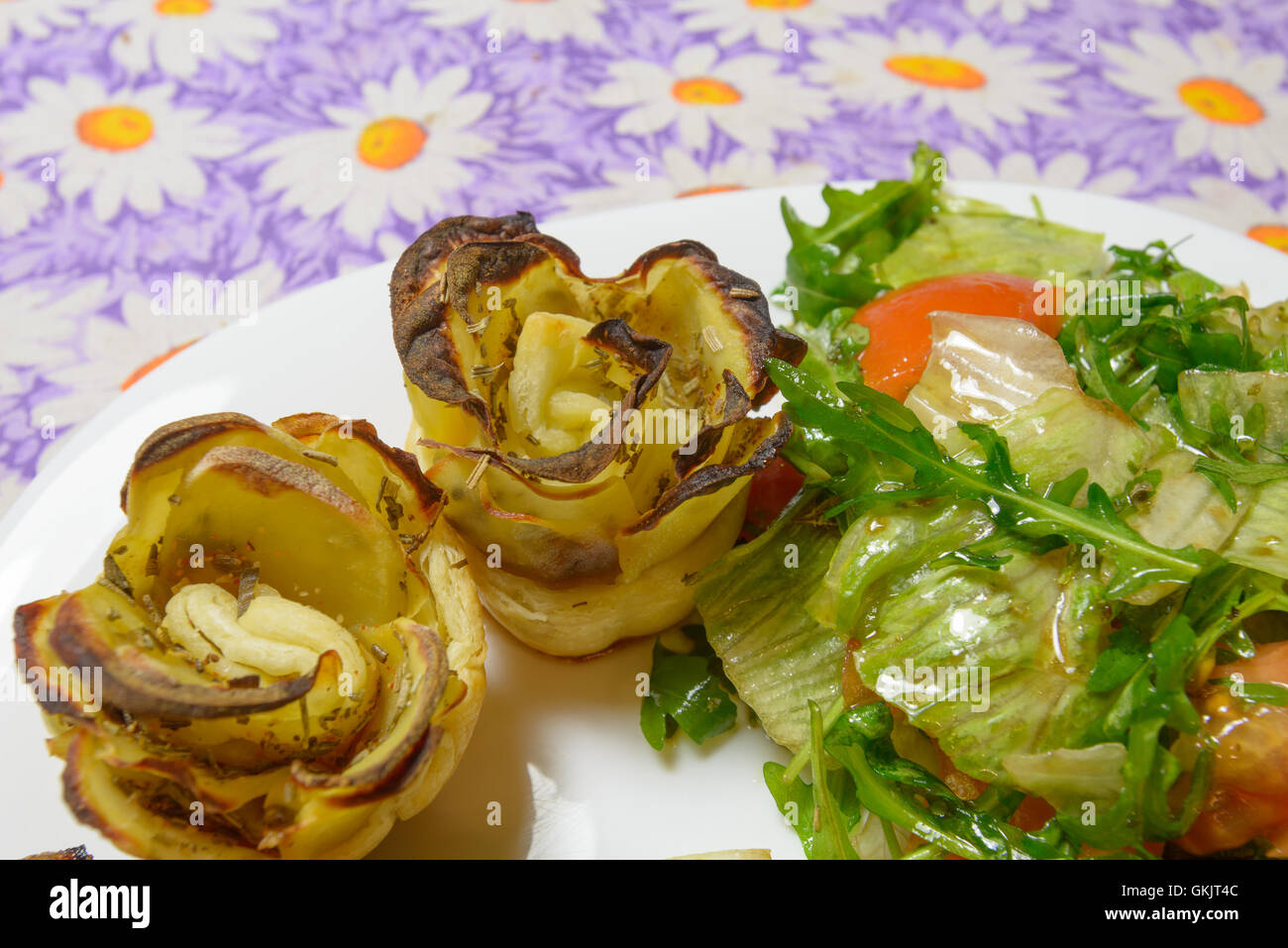 Italian style green salad and potatoes with tomatoes Stock Photo