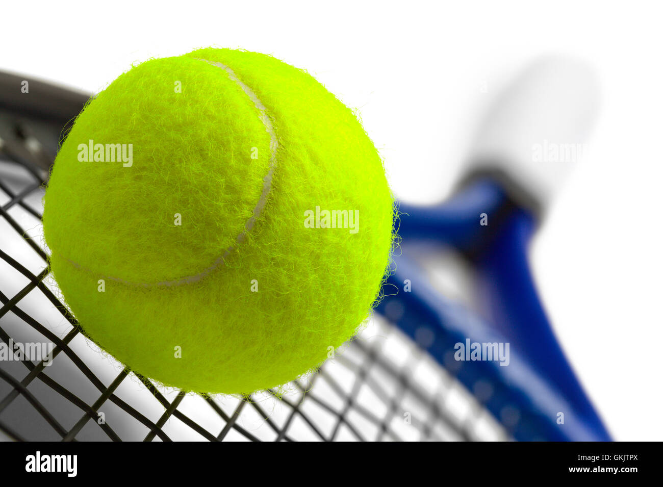 Blue and Black Tennis Racket with Green Ball Isolated on White Background. Stock Photo