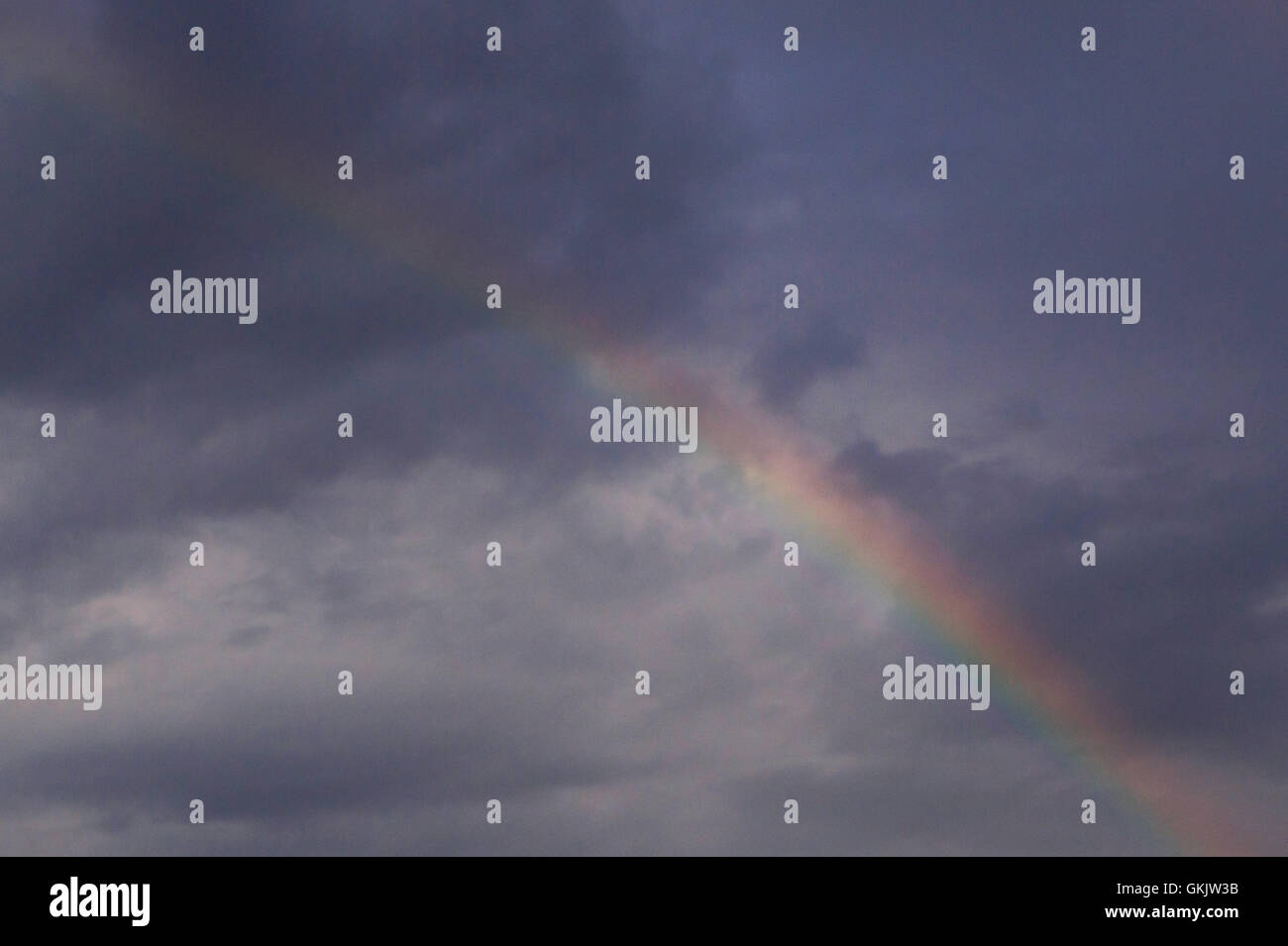 Blue sky with clouds and rainbow hi-res stock photography and images ...