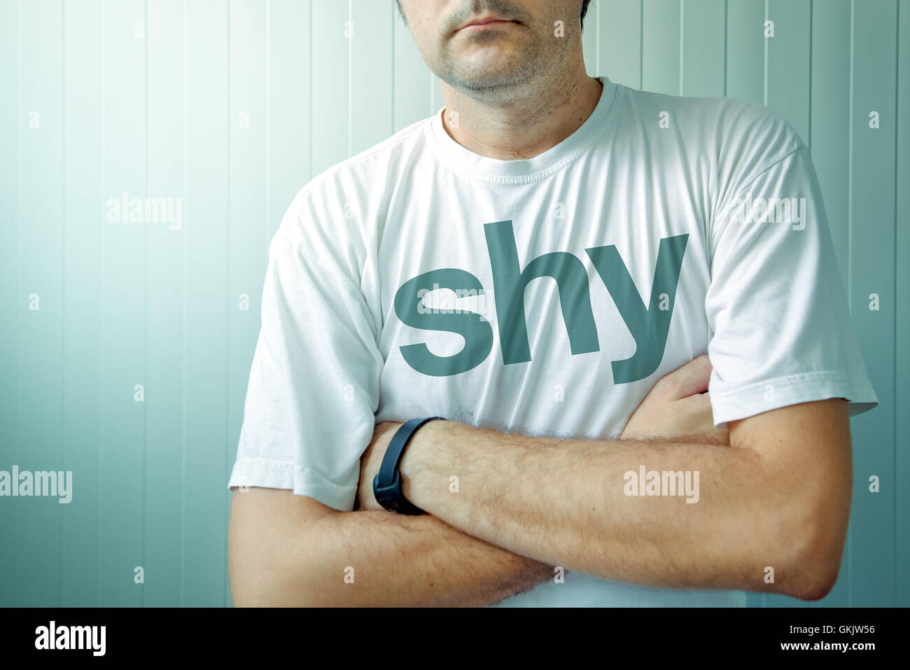 Adult man wearing shirt with Shy title Stock Photo