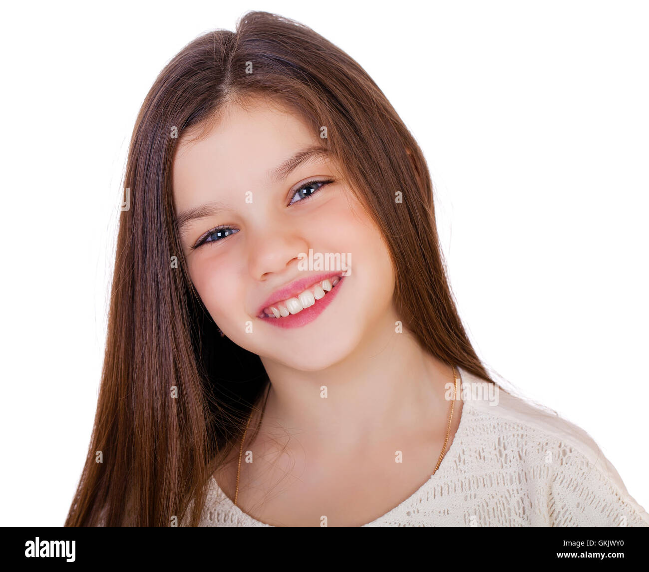Portrait of a charming little girl smiling at camera, isolated on white ...