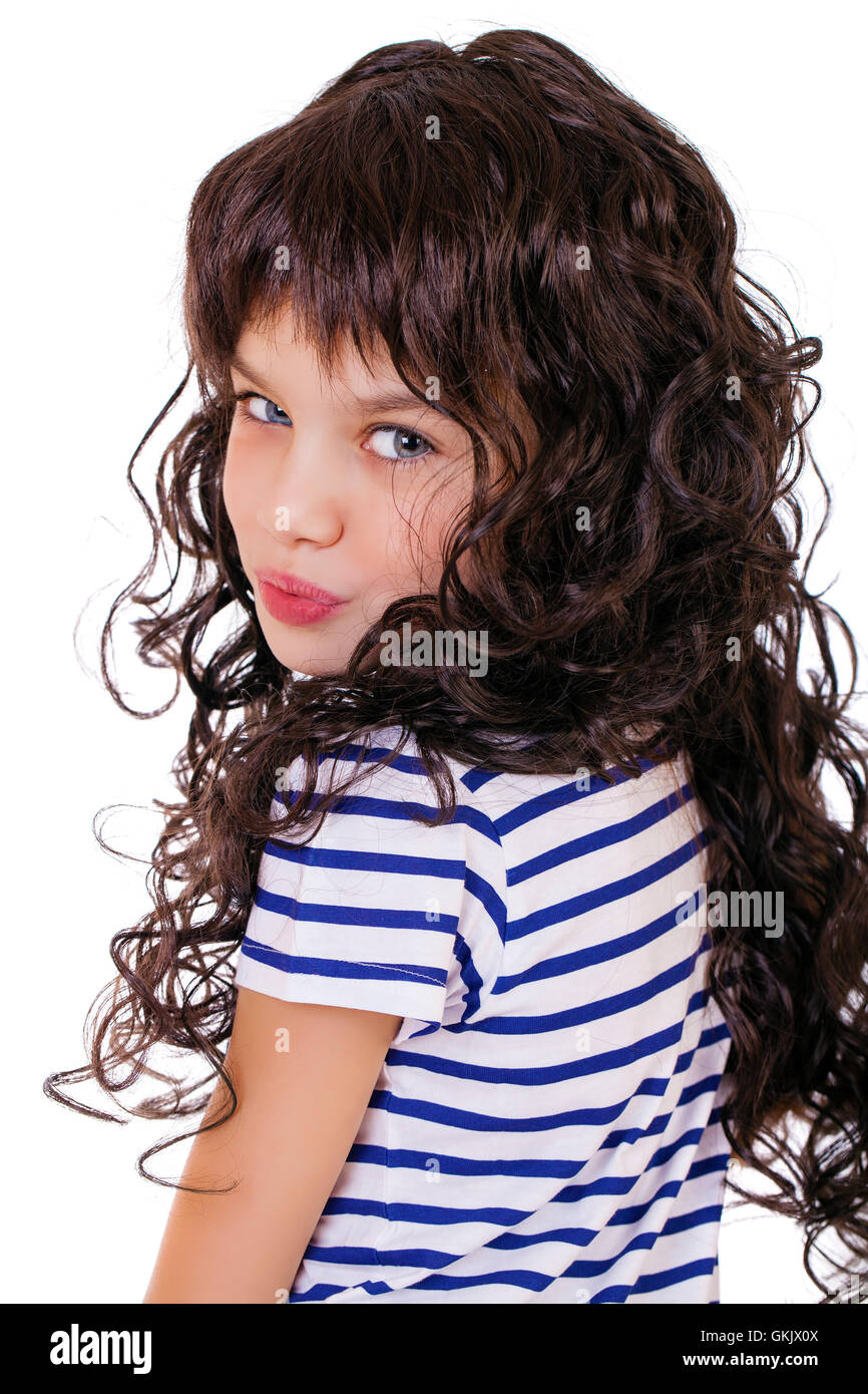 Portrait of a charming little girl smiling at camera, isolated on white ...