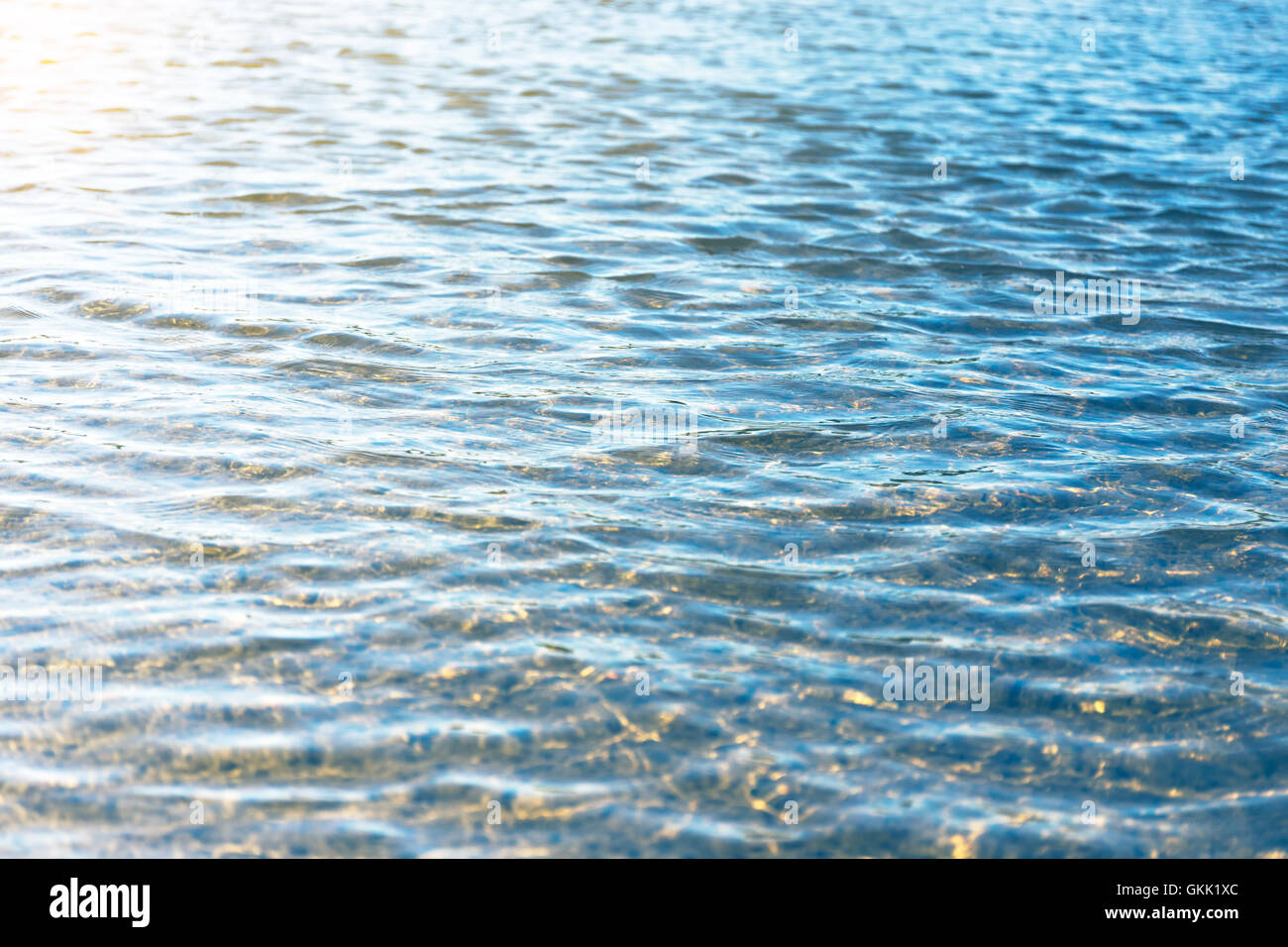 Water surface with reflections from the rays of sunlight Stock Photo ...