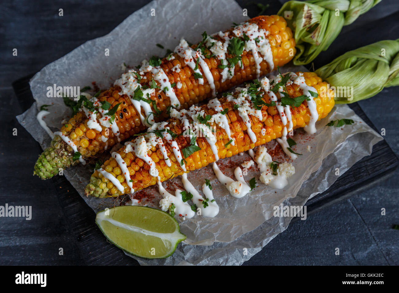 Elote or Mexican grilled corn on the cob served with cotija cheese and