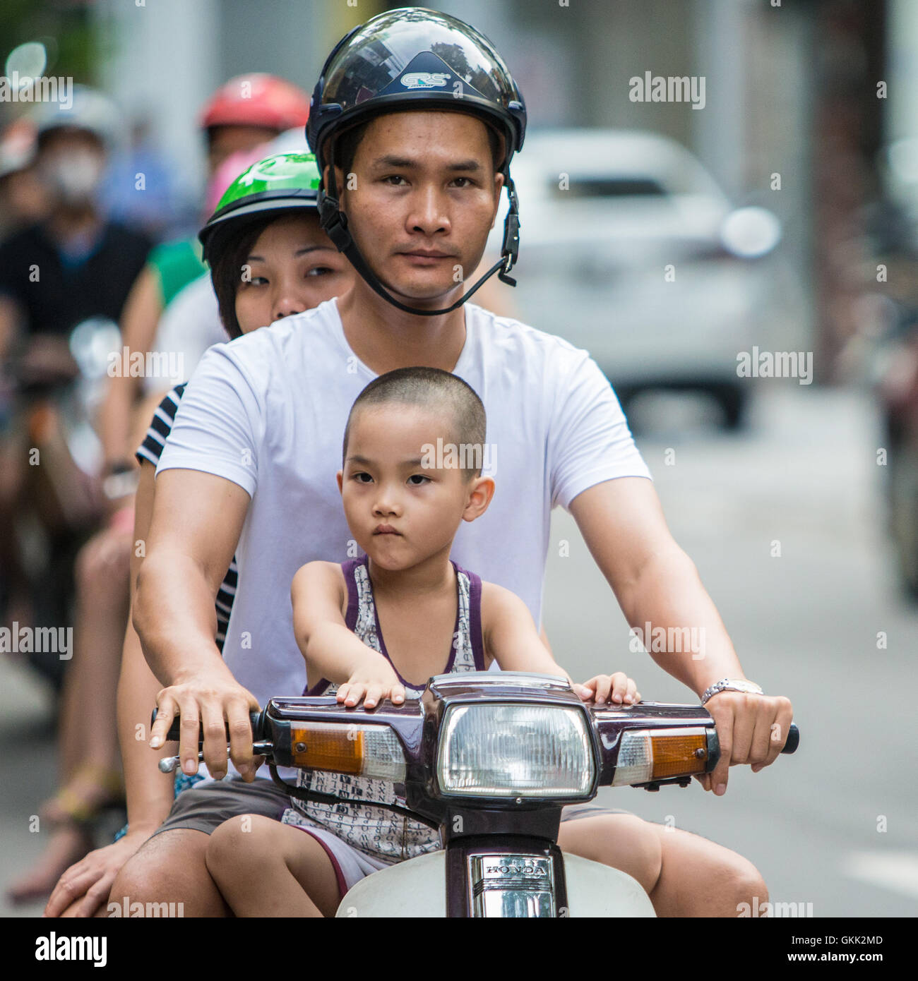 Vietnamese Motorcycle Rider Vietnamese Moped Motorcycle Motorbike Riders on the streets of Hanoi in ...