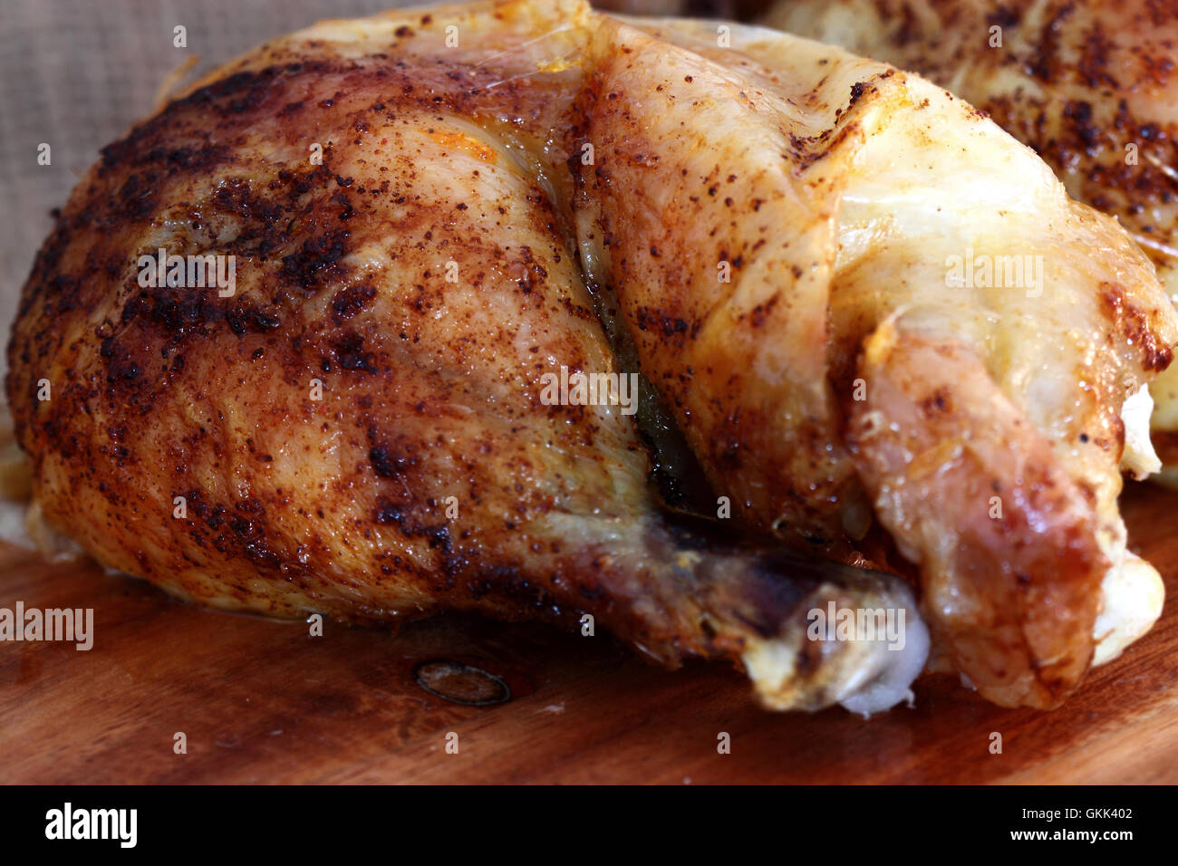 Roast chicken thigh chopping board Stock Photo Alamy