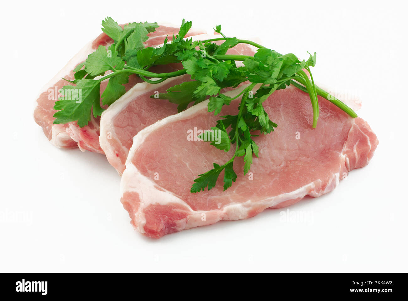 Pork loin steaks with herbs Stock Photo
