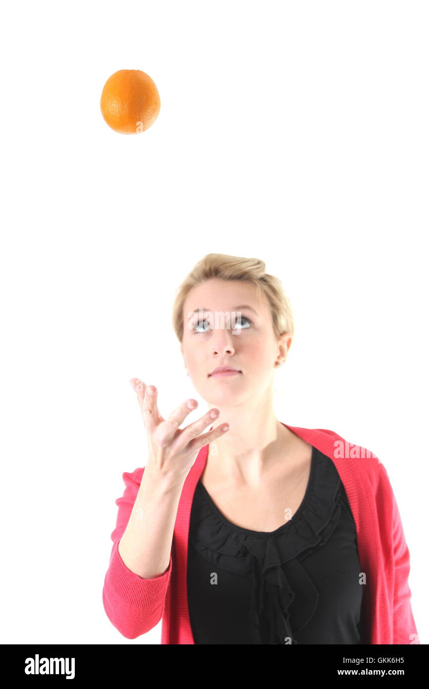 woman juggling with an orange Stock Photo Alamy