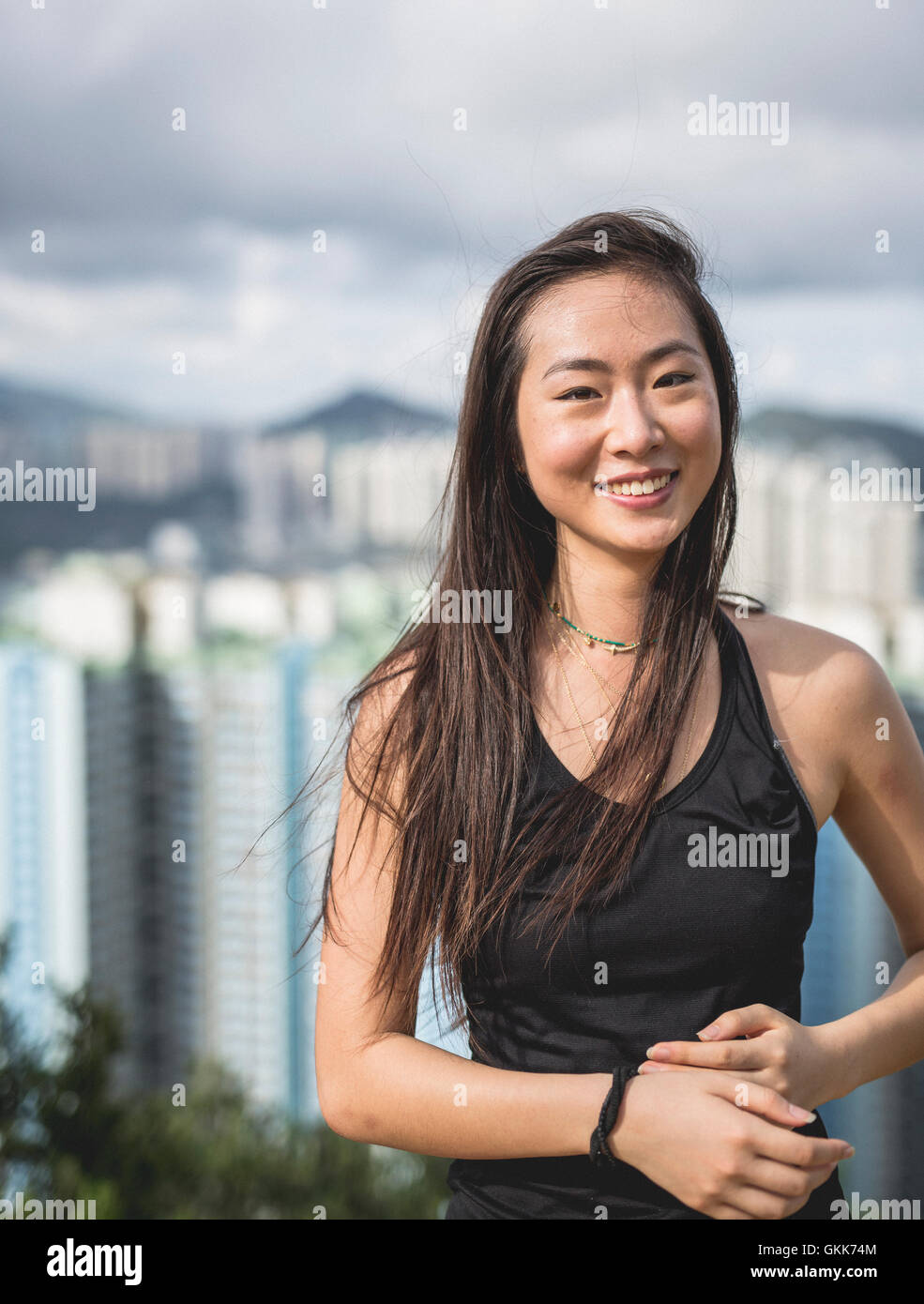 Woman on top mountain stretching hi-res stock photography and images ...