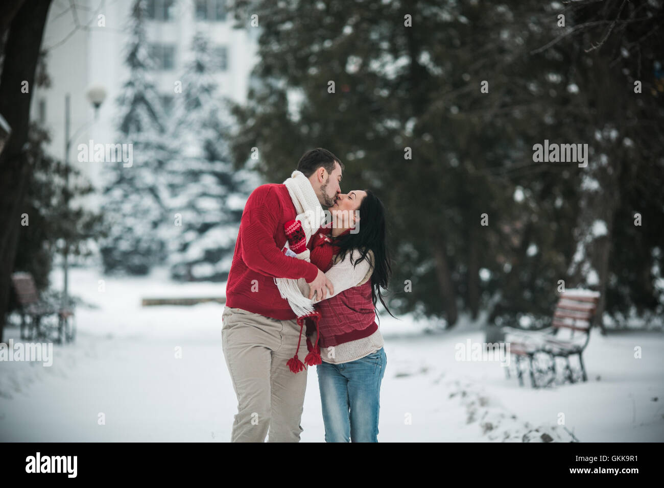 Beautiful young couple kissing in the park Stock Photo - Alamy