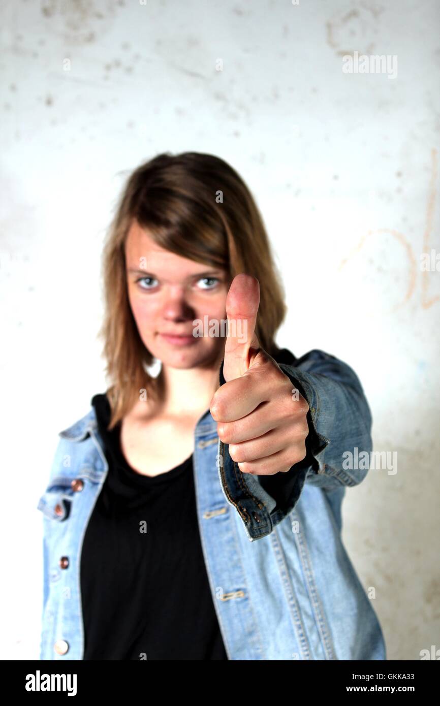 Portrait woman showing thumbs up hi-res stock photography and images ...