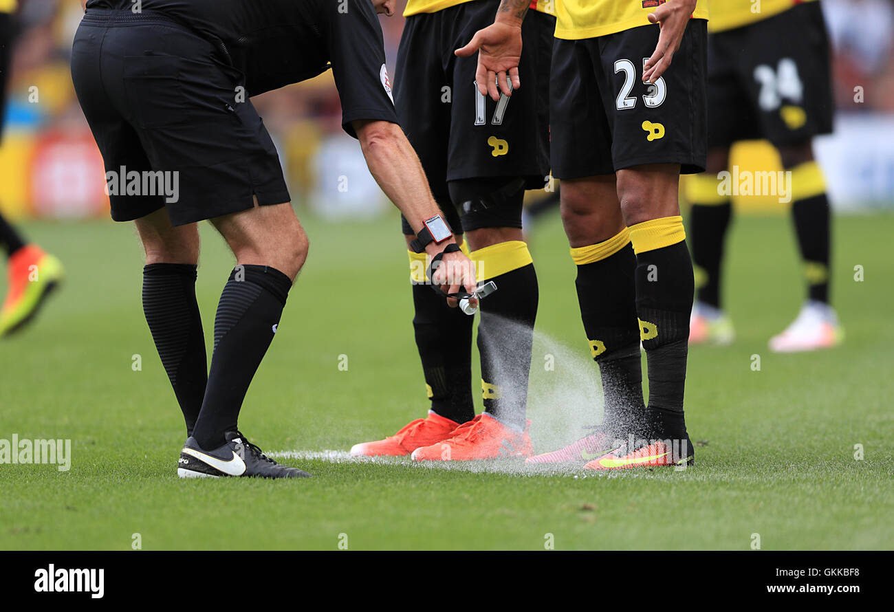 Referee Jon Moss sprays vanishing spray prior to a Chelsea free kick