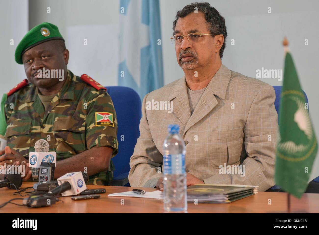 Force Commander of the African Union Mission in Somalia, Lt. Gen. Silas Ntiguririwa listens in as SRCC Mahamet Saleh Anadif makes a comment during a Press confrence on 9th January 2013 in Mogadishu. AU UN IST PHOTO / David Mutua Stock Photo