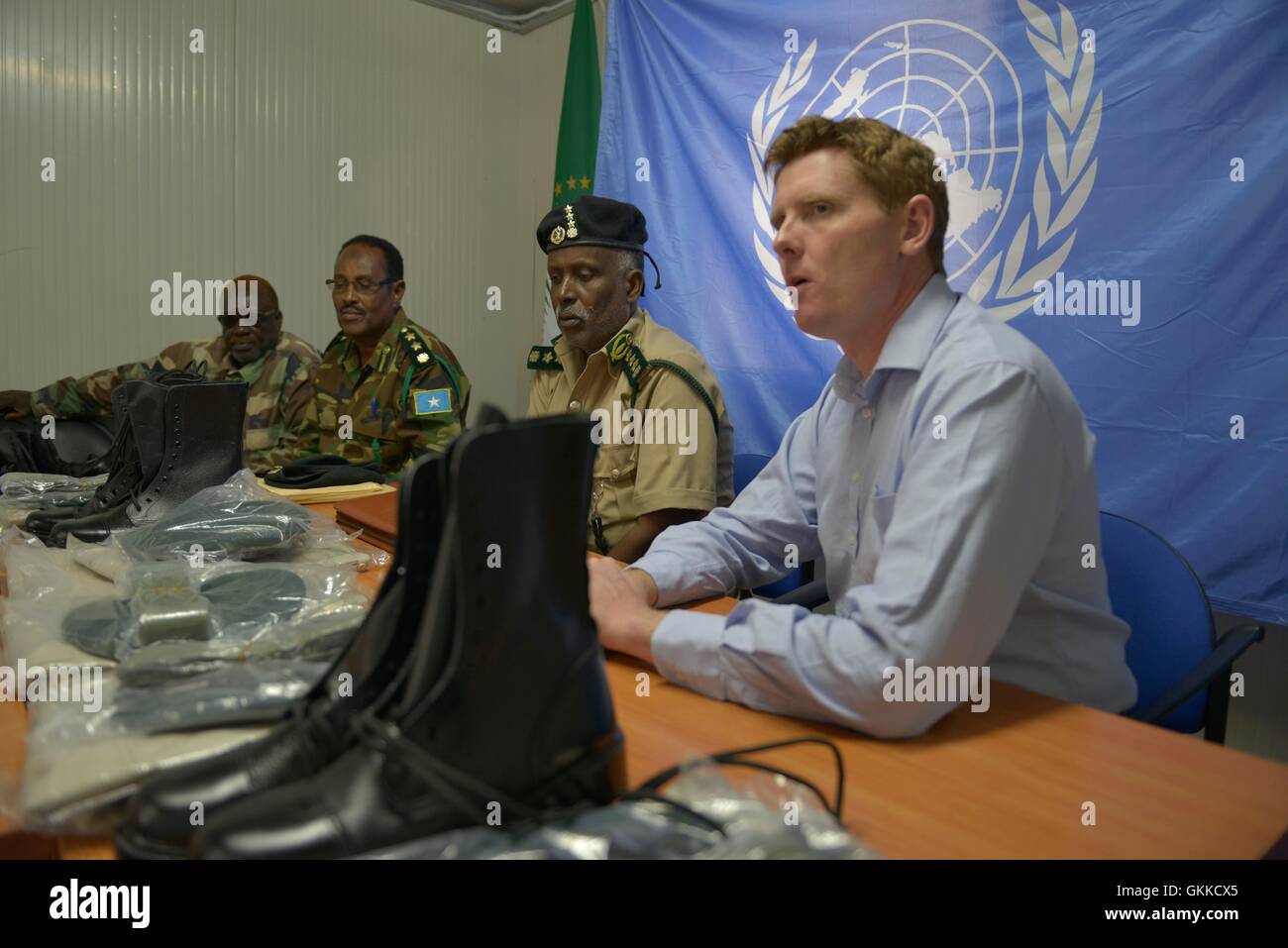Regional coordinator of UNODC Alan Cole talks to Prison Commissioner Gen. Hussein Hassan Osman  during a handover of Uniforms to Somali Custodial Corps on 19th February 2014 Stock Photo