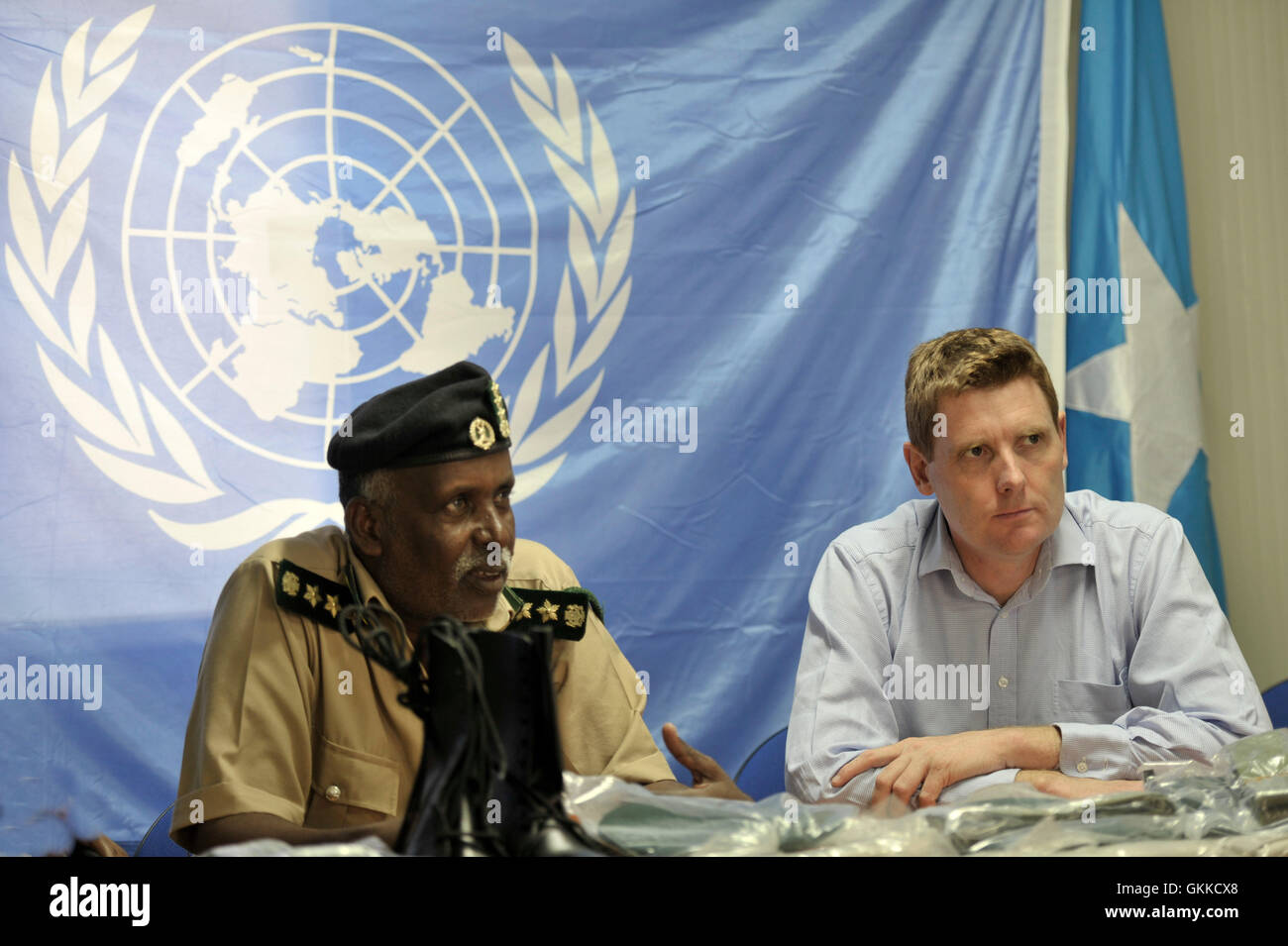 Prison Commissioner Gen. Hussein Hassan Osman talks to regional coordinator of UNODC Alan Cole during a handover of Uniforms to Somali Custodial Corps on 19th February 2014. Stock Photo