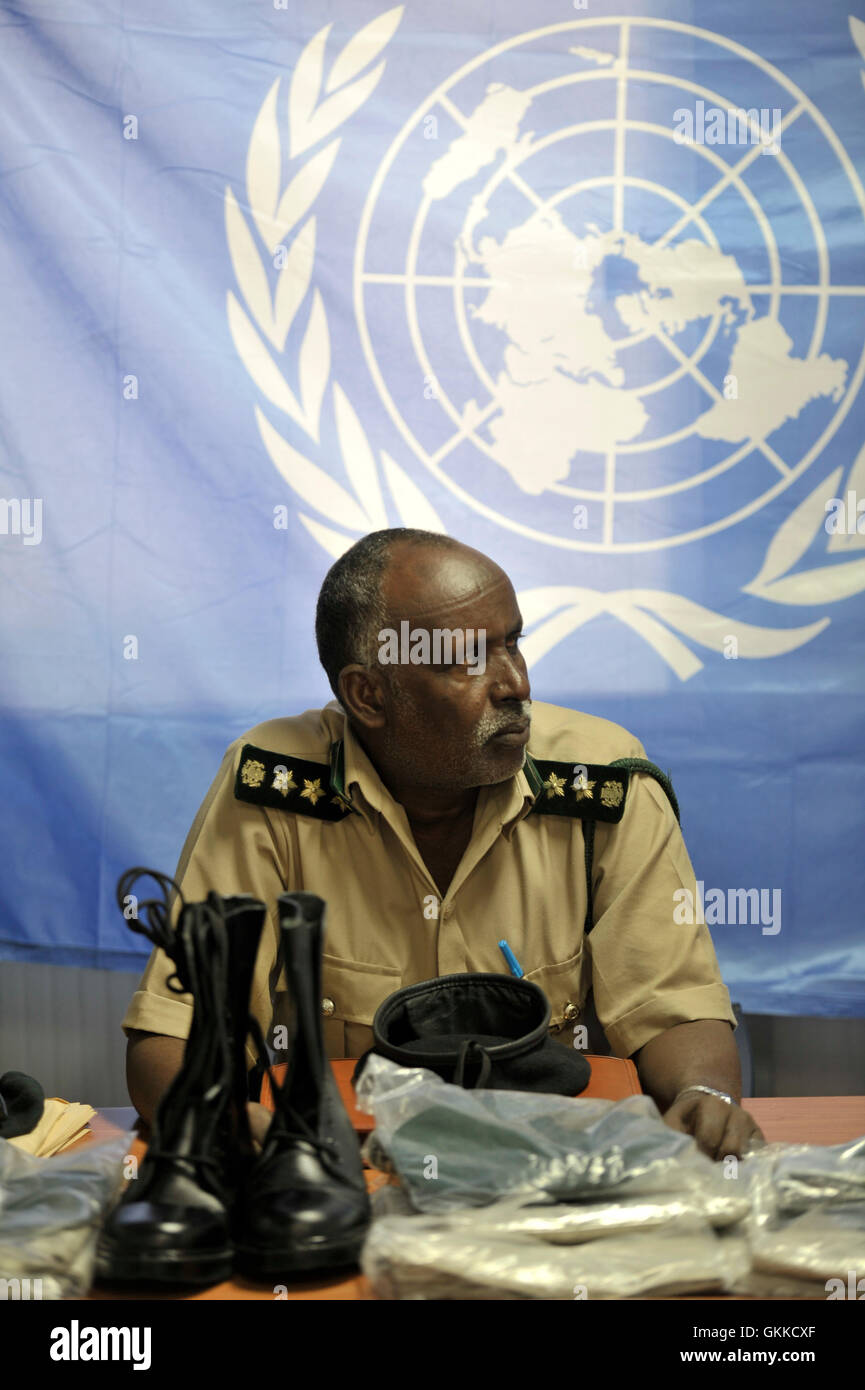 Prison Commissioner Gen. Hussein Hassan Osman listens to regional coordinator of UNODC Alan Cole during a handover of Uniforms to Somali Custodial Corps on 19th February 2014. Stock Photo