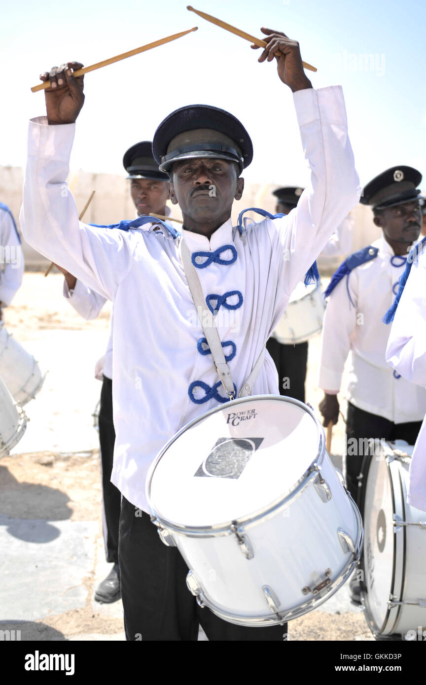A member of the Police band drumline practices before the handover of ten vehicles to the Somali National Police on 1st March 2014. Stock Photo