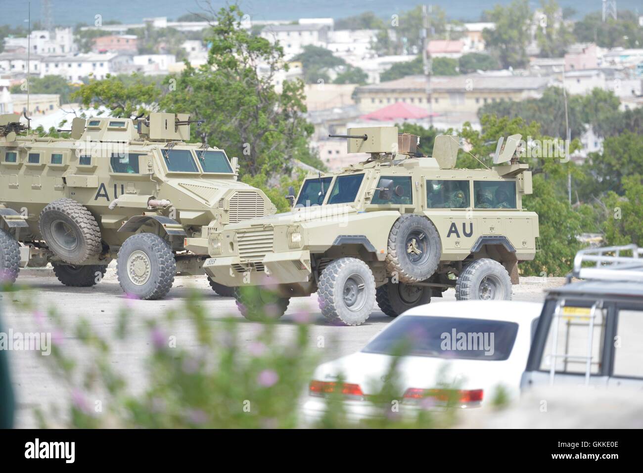 An AMISOM Armoured Personel Carrier arrives at parliament buildings to reinforce the group already there during an attack by Alshabaab on parliament on 24th May 2014. Stock Photo