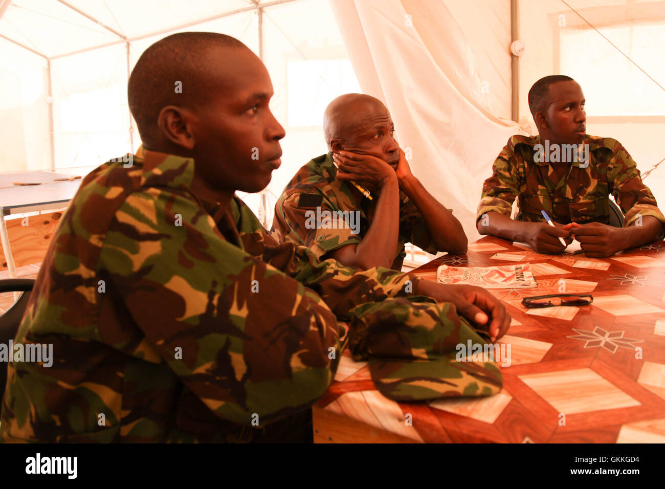Firefighters in Kismayo, Somalia, listen to a presentation during a  training course for 20 AMISOM and IJA firefighters conducted by the United Nations Support Office for AMISOM (UNSOA) on November 15. UN Photo Stock Photo