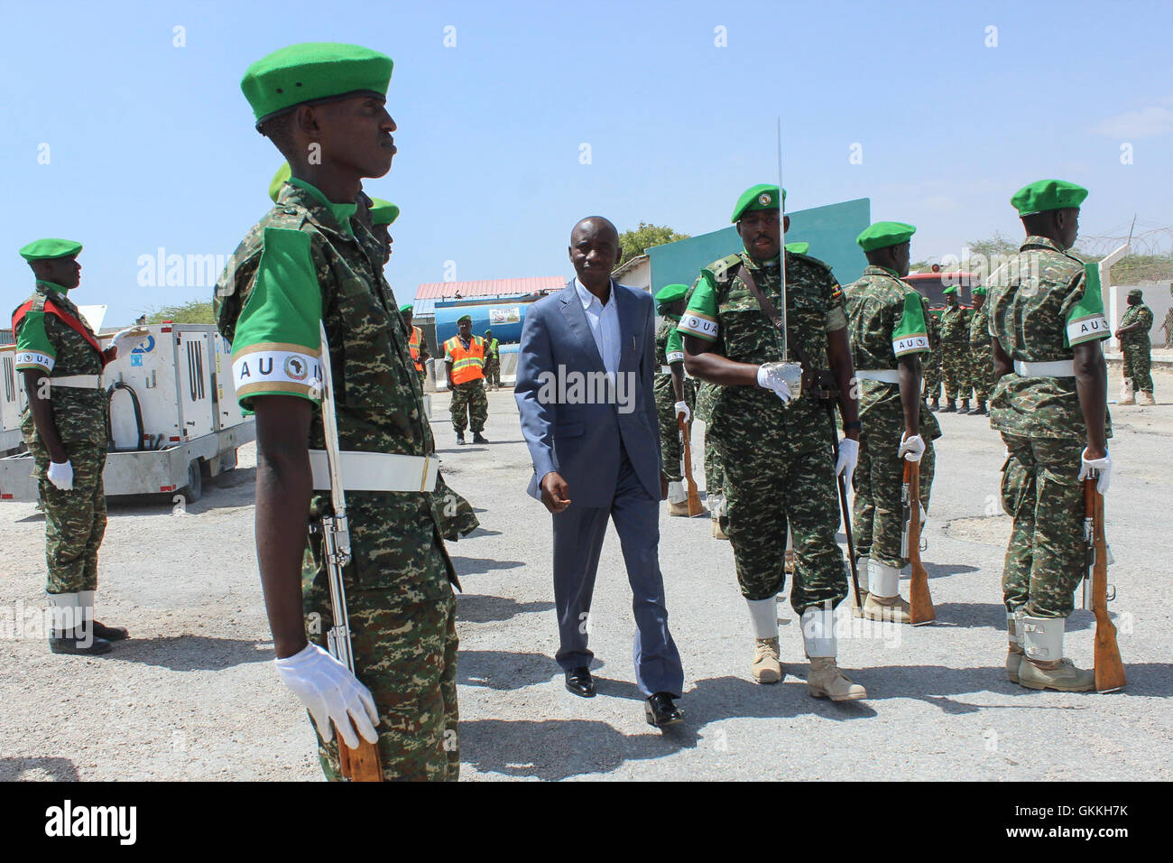 Maj. Gen Prime Niyongabo inspects a guard of hornour mounted by AMISOM forces at Aden Abdulle International airport in Mogadishu. AMISOM Photo/Mahamud Hassan Stock Photo