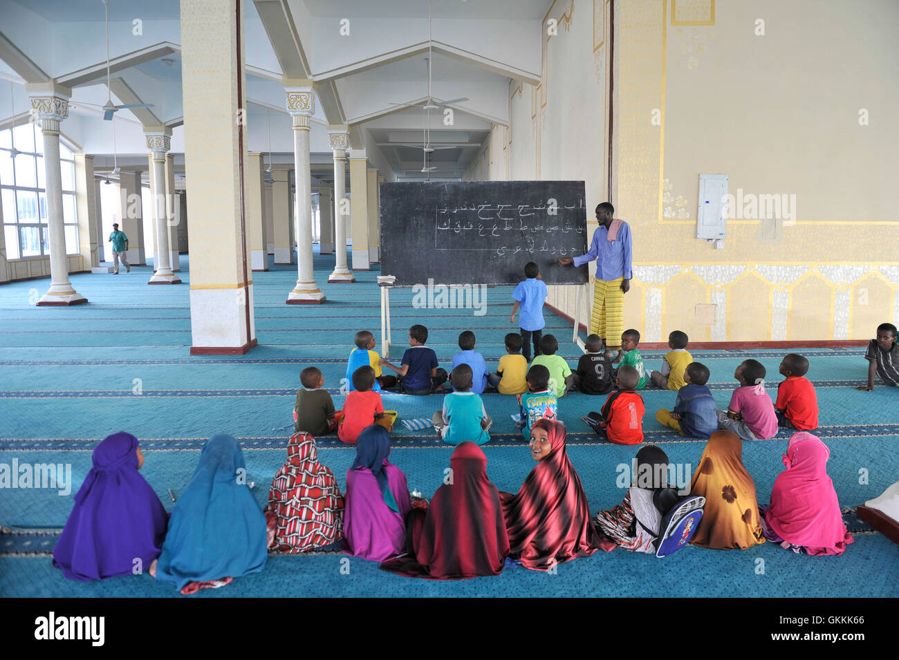 Somali children take lessons on the Quran at a Madrasa in Isbahaysiga mosque on June 16, 2015 as muslims prepare for the fasting month of Ramadan, the holiest month in the Islamic calendar.AMISOM Photo/Omar Abdisalan Stock Photo